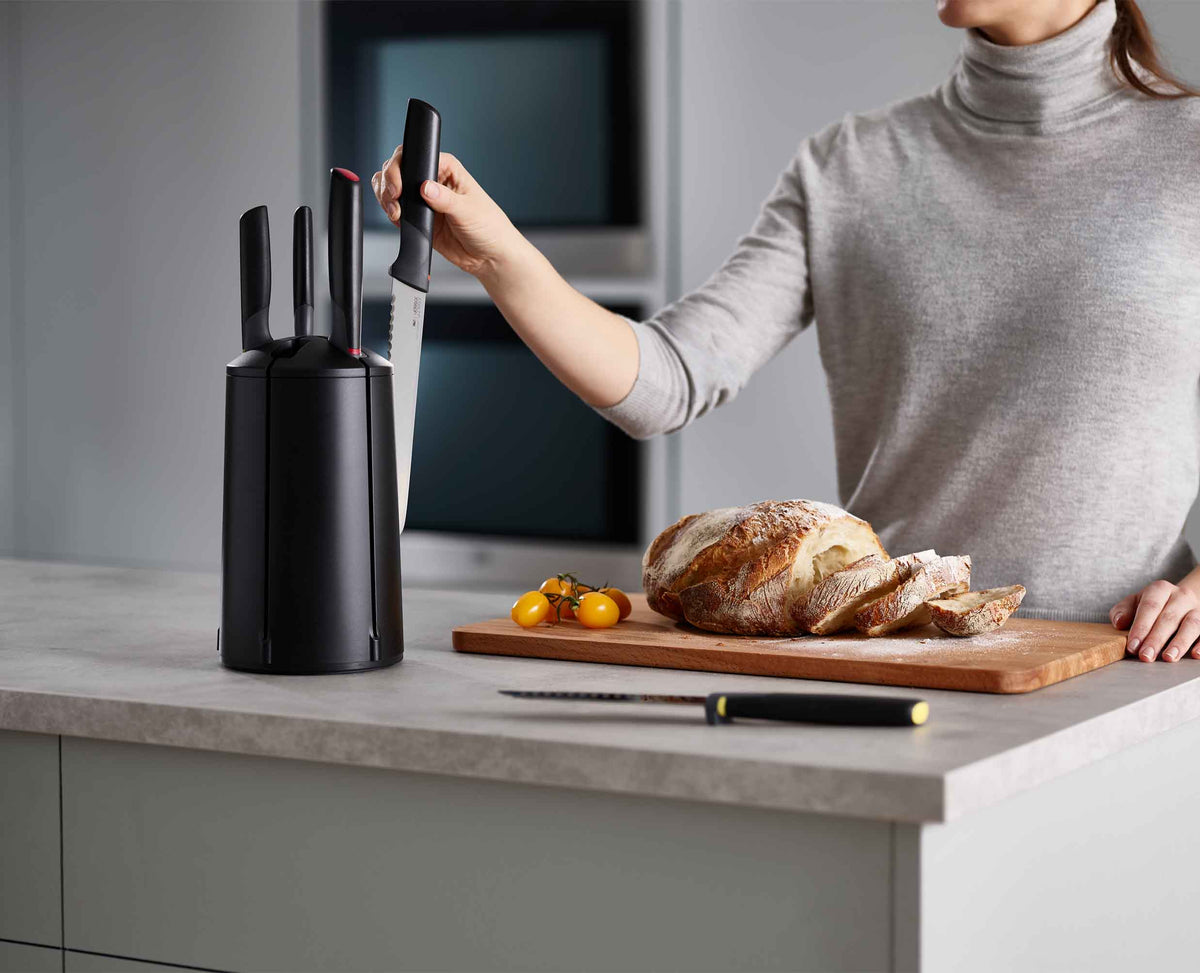 Elevate knife resting on worktop with raised blade tip