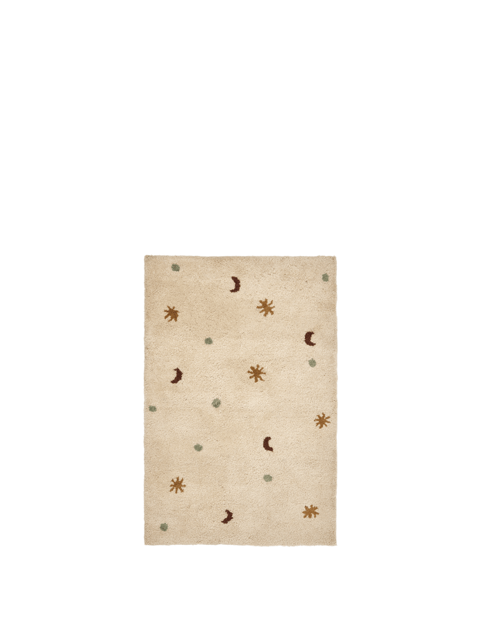 ferm LIVING Skye tufted rug in parchment with moon, star and dot motifs