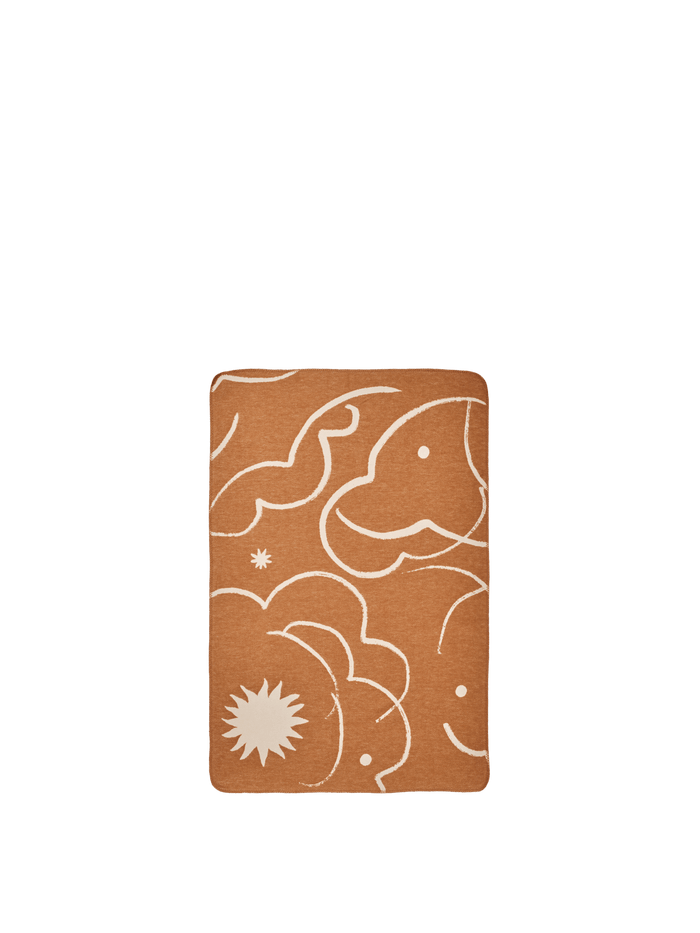 ferm LIVING Skye blanket in sienna and parchment with celestial pattern