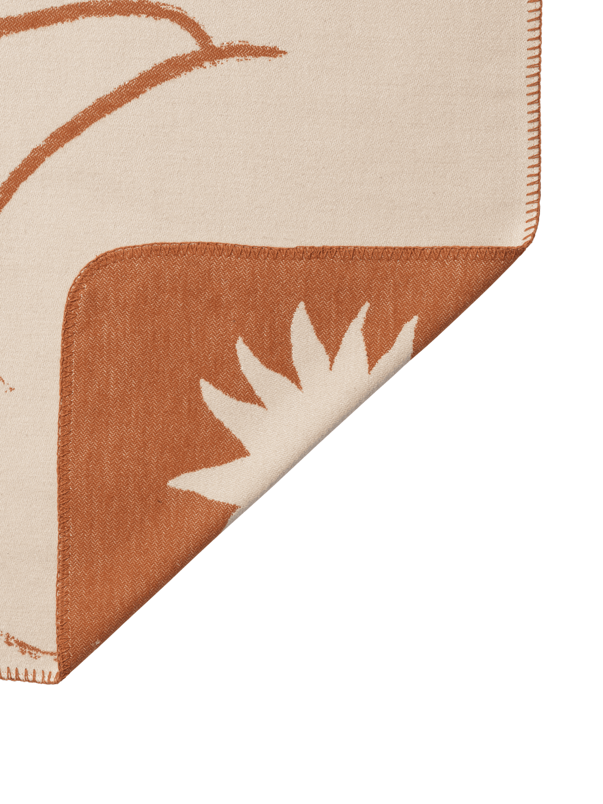 Folded Skye blanket showing decorative stitched edge
