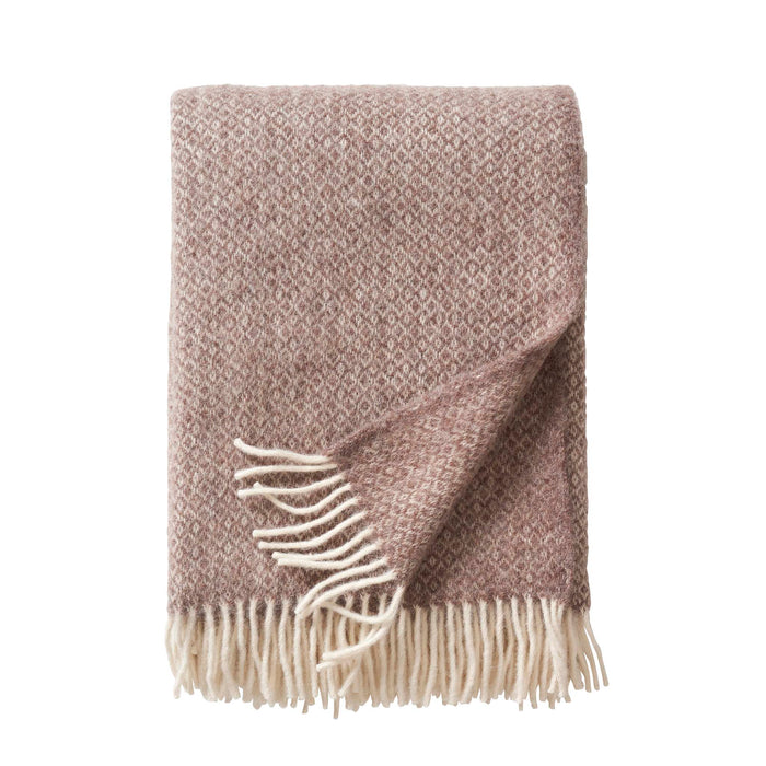 Klippan Lima alpaca and lambswool throw in sand, folded with fringes visible