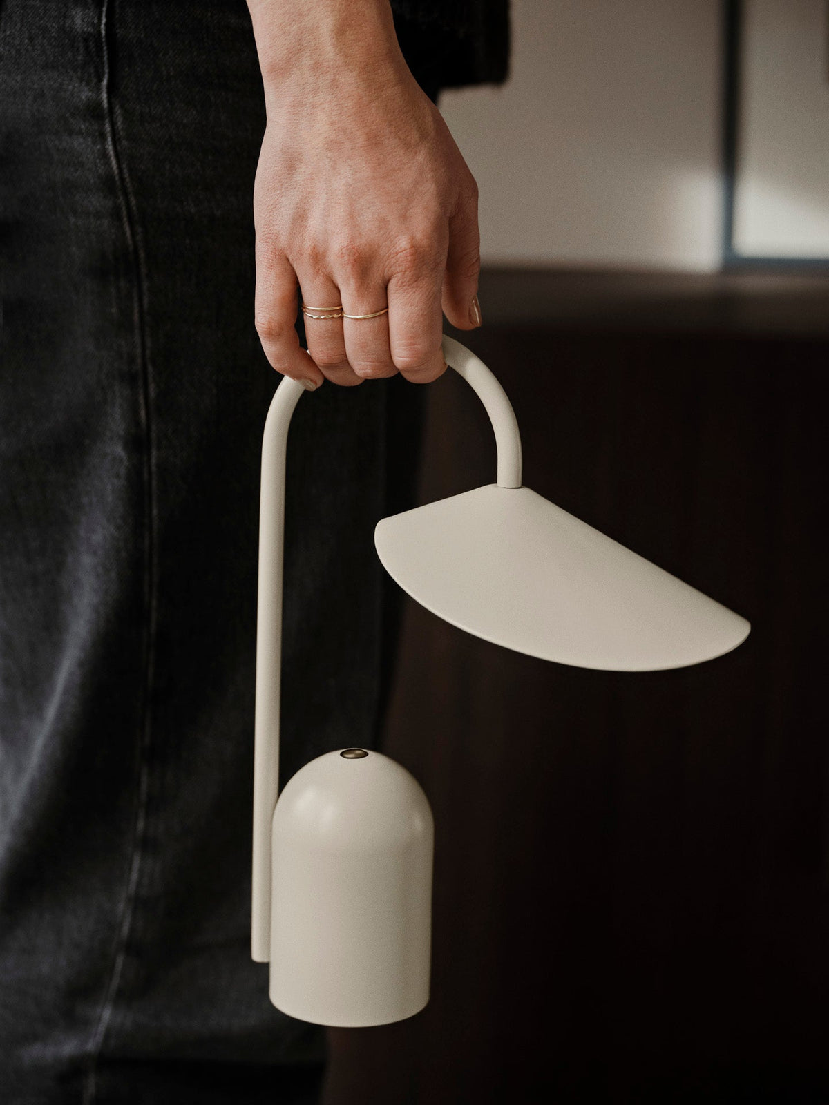 Arum portable lamp glowing softly in a living space