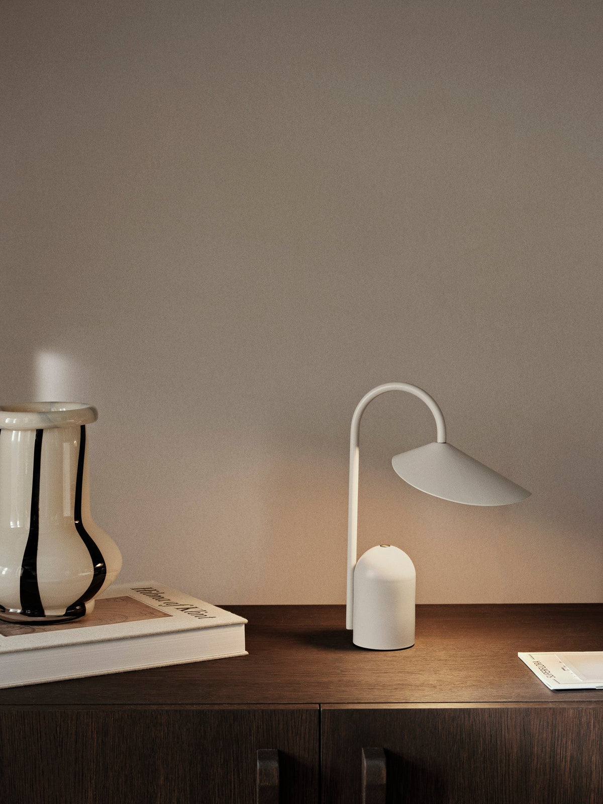 Arum portable lamp styled on a bedside table