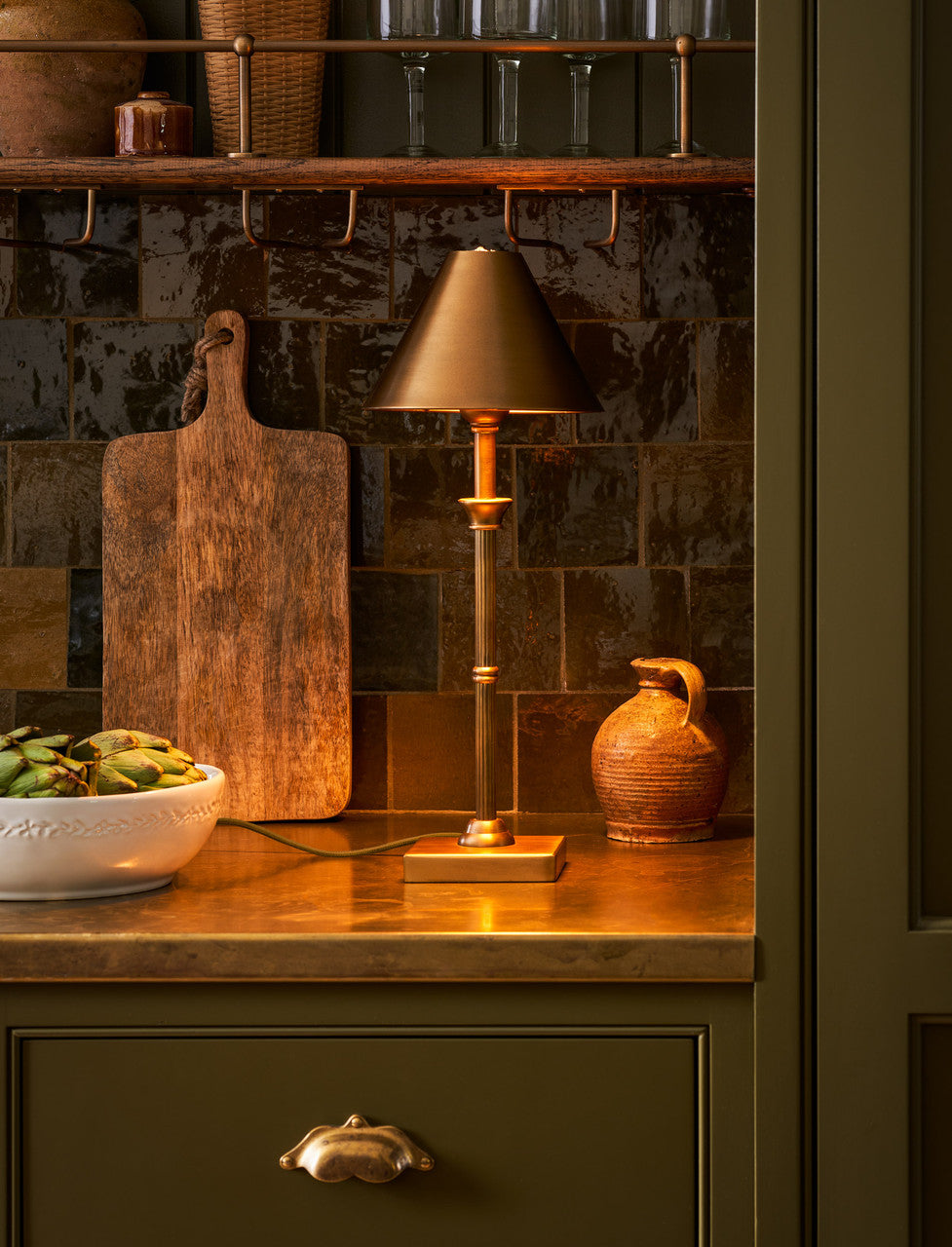 Kelmscot table lamp styled on a wooden side table