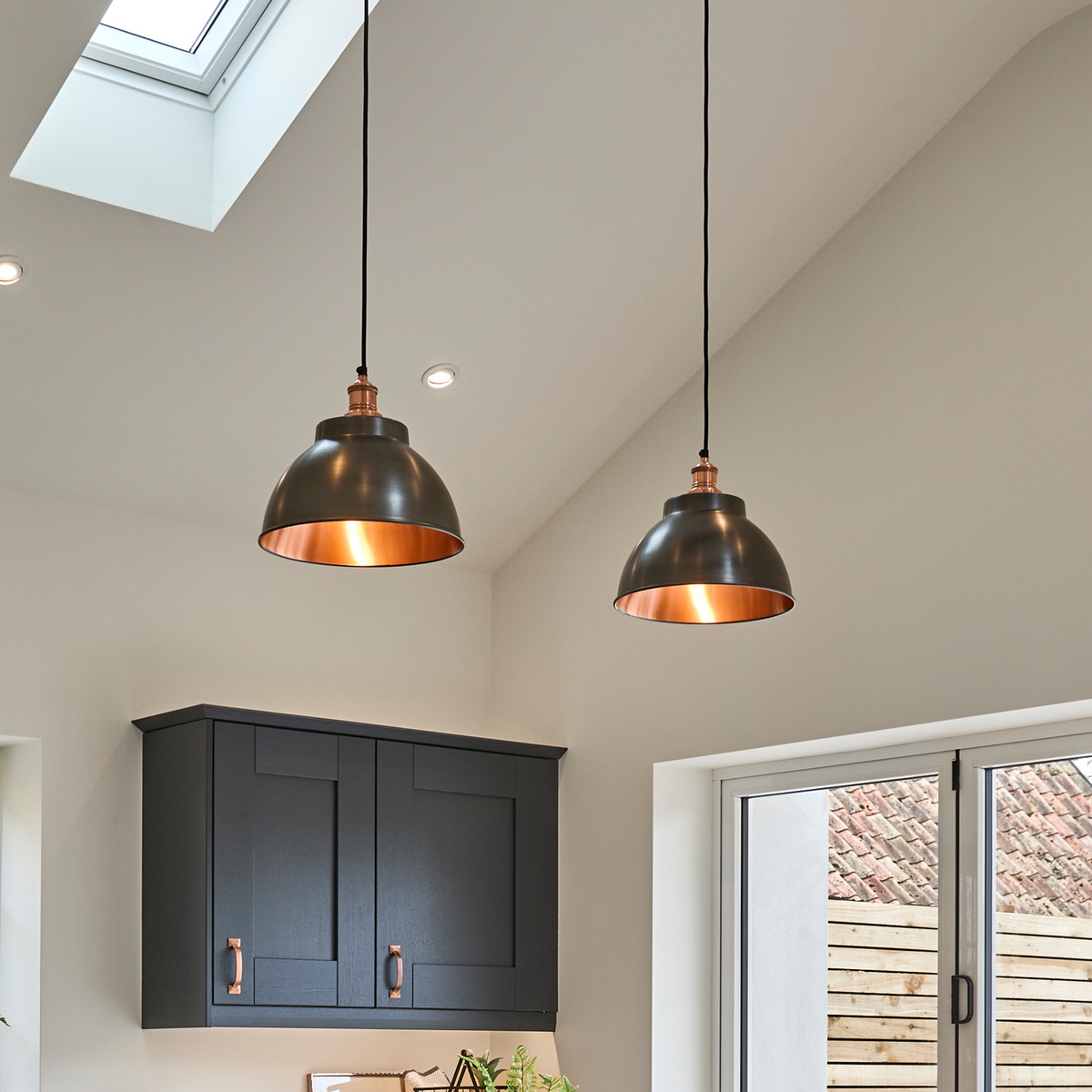 Brooklyn Dome pendants hung over a kitchen island