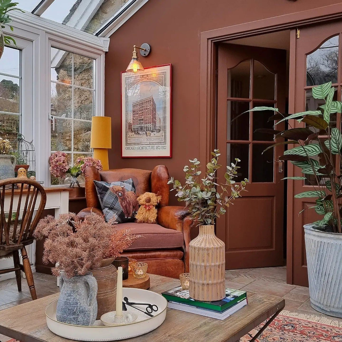 Brooklyn funnel wall light in a bright conservatory