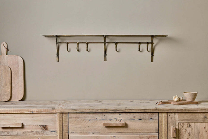 Nkuku Basti – iron storage shelf with hooks, antique brass