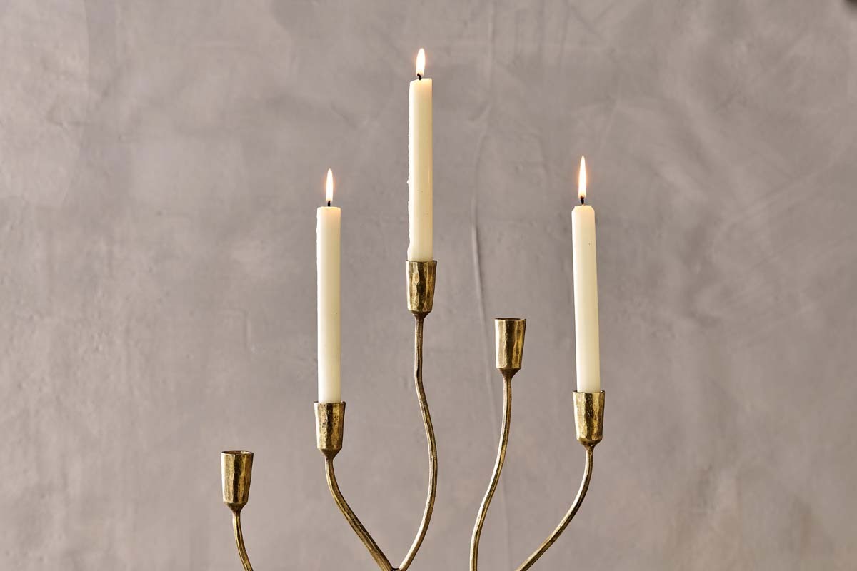 Palani candelabra with lit dinner candles