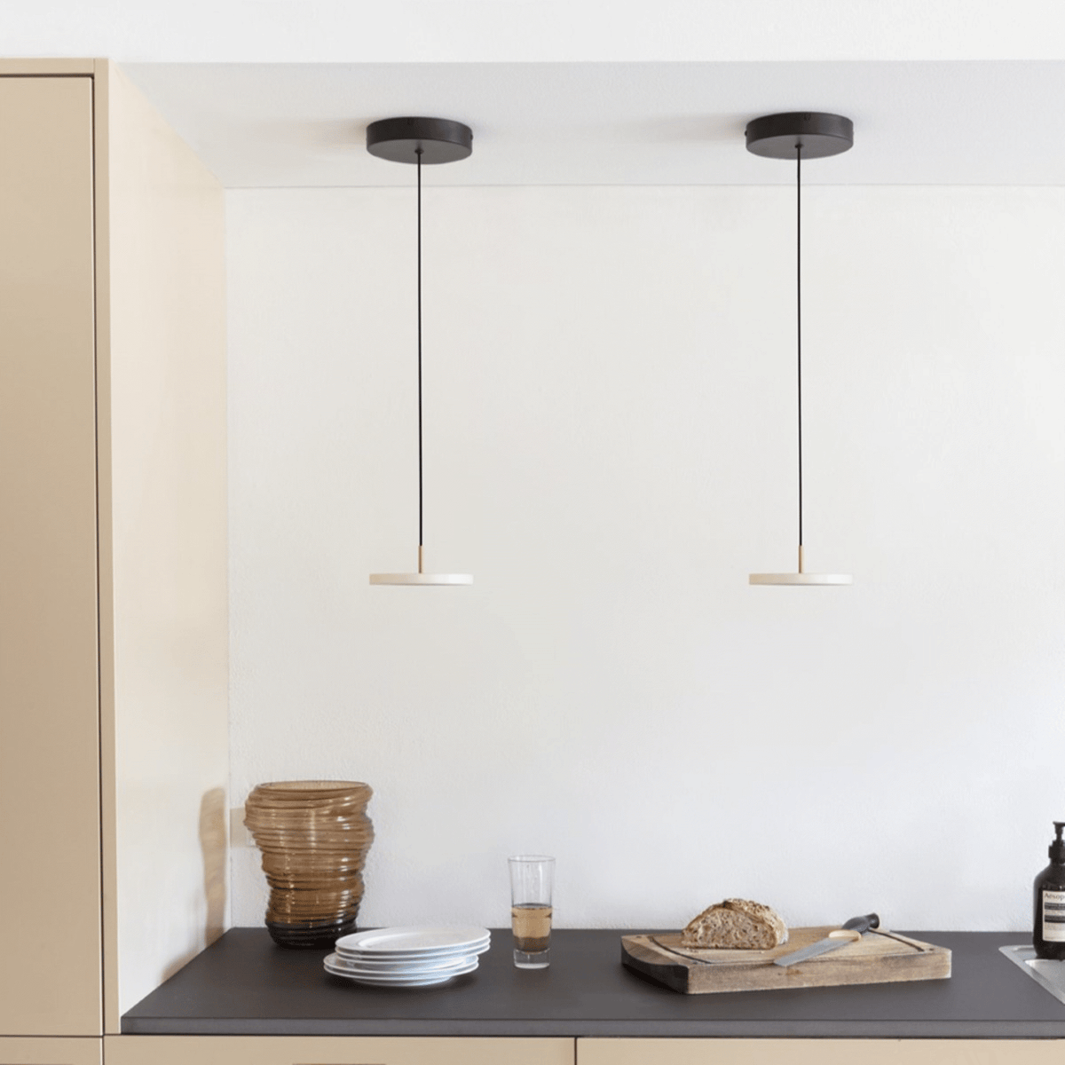 Asteria Micro pendant hung in a bright interior