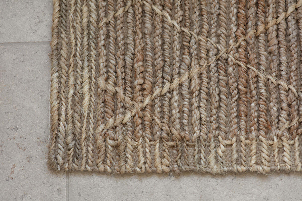 Vandi jute doormat by an entrance door