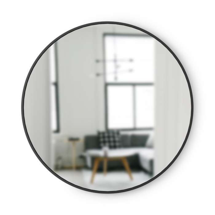 Umbra Hub round wall mirror with black rubber frame on white background