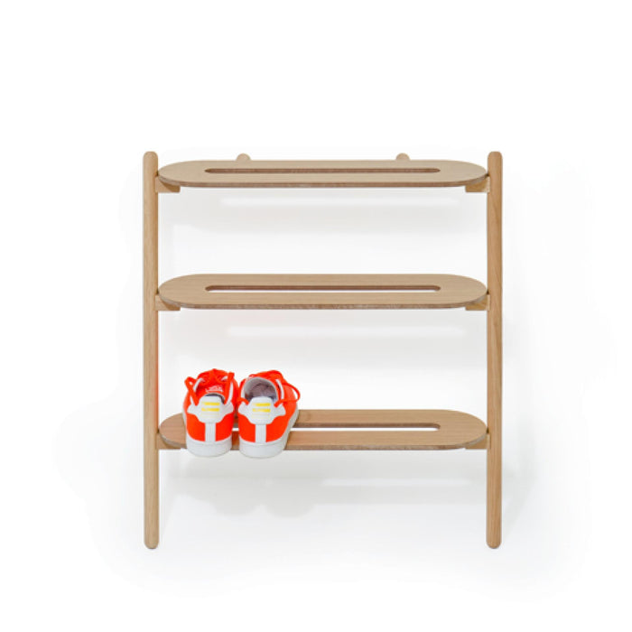 Wireworks Heel Bar oak shoe rack leaning against a wall