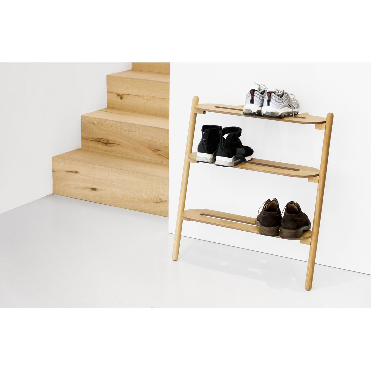 Heel Bar shoe tidy in a hallway with shoes and boots