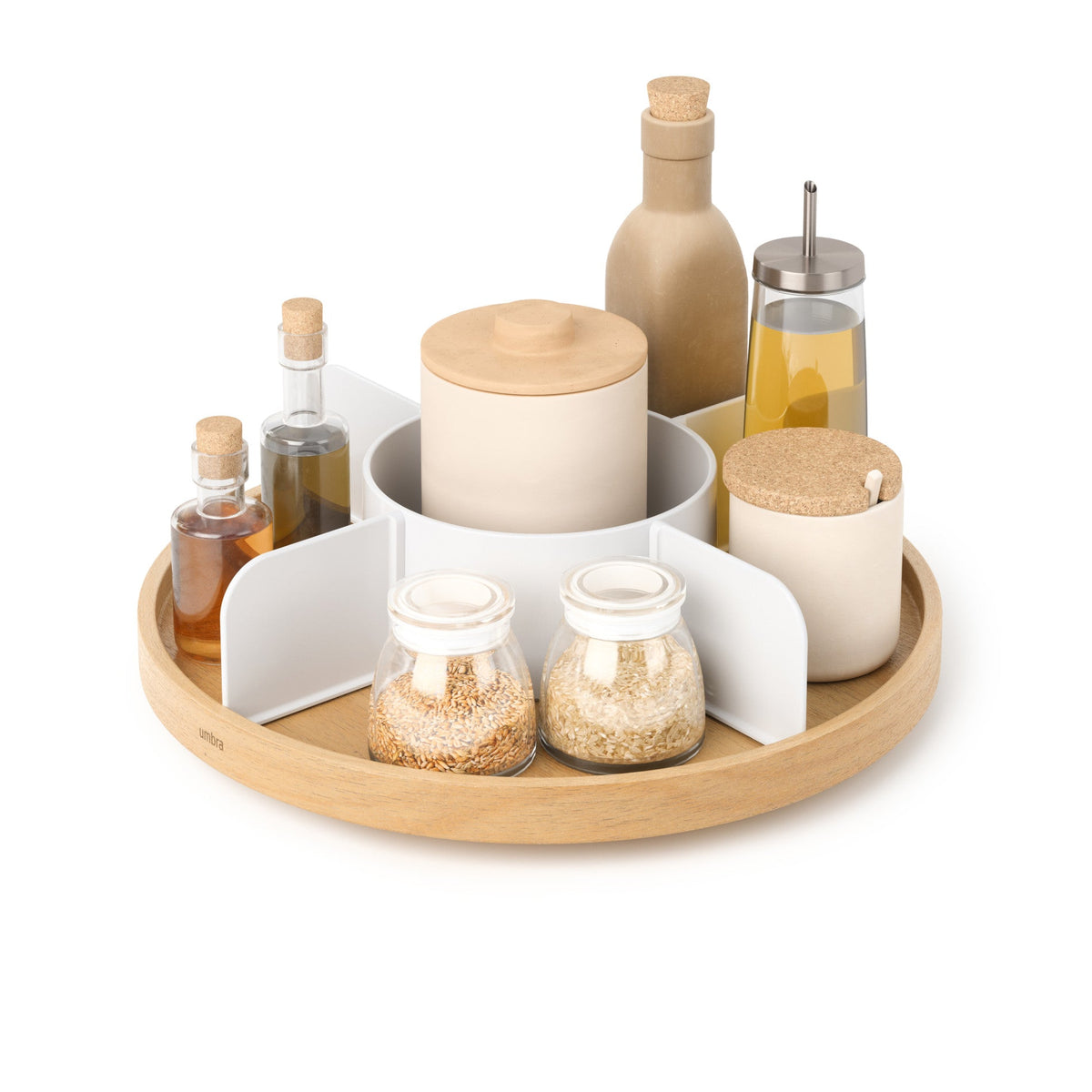 Umbra Bellwood lazy susan loaded with jars, oils and spices